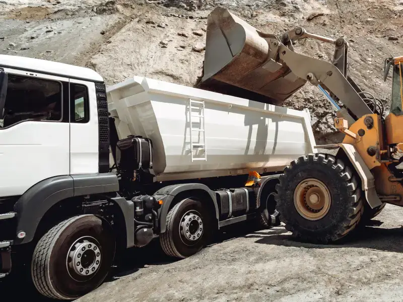 Loader filling a dump truck on an excavation job in Jarvisburg, NC