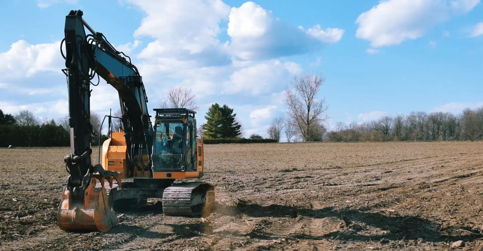 Excavator clearing and prepping a wooded lot in Jarvisburg, NC