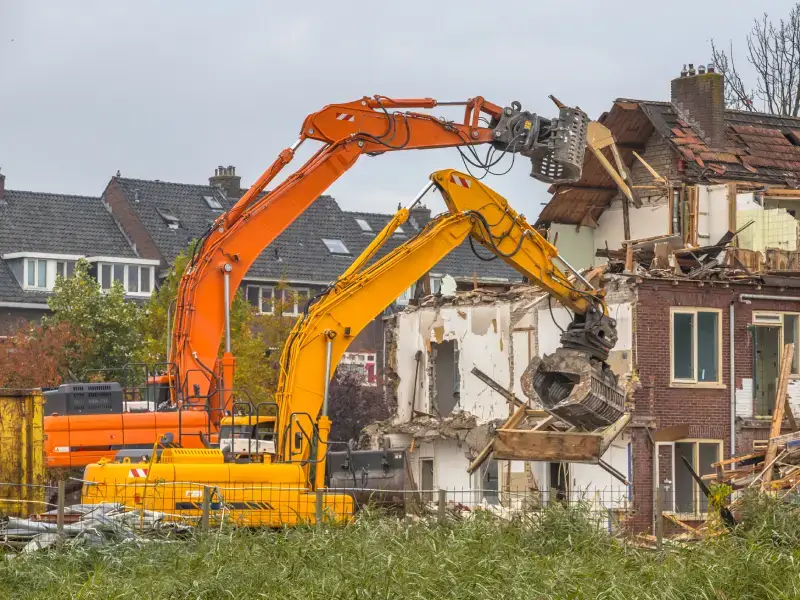 Excavator demolishing a structure in Jarvisburg, NC